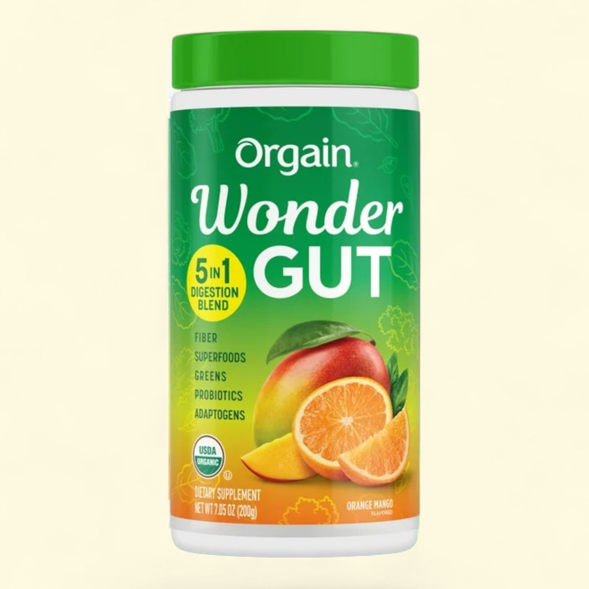 Orgain Wonder Gut supplement container with green lid and colorful label on a light beige background