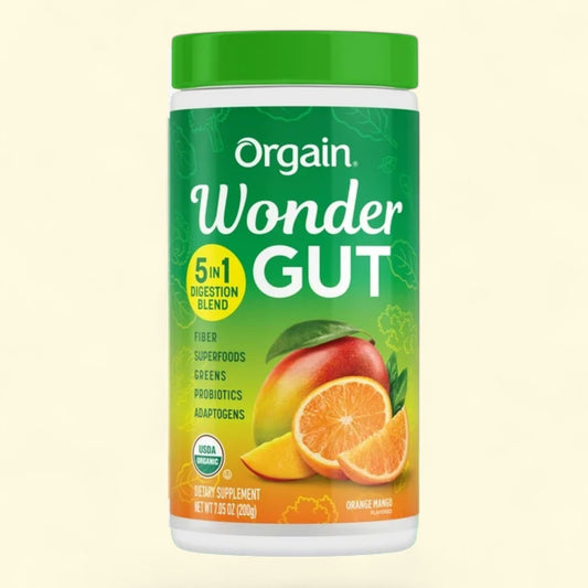 Orgain Wonder Gut supplement container with green lid and colorful label on a light beige background