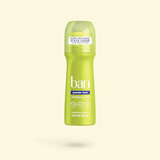 Green bottle of Ban powder fresh deodorant on a light beige background