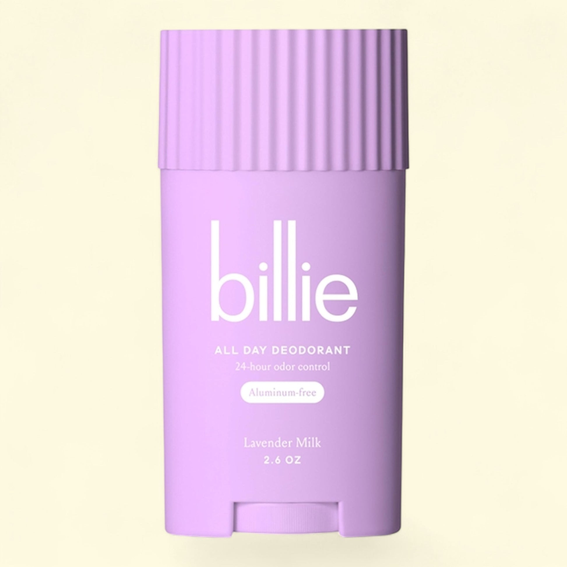 Purple deodorant stick with 'billie' branding on a light yellow background