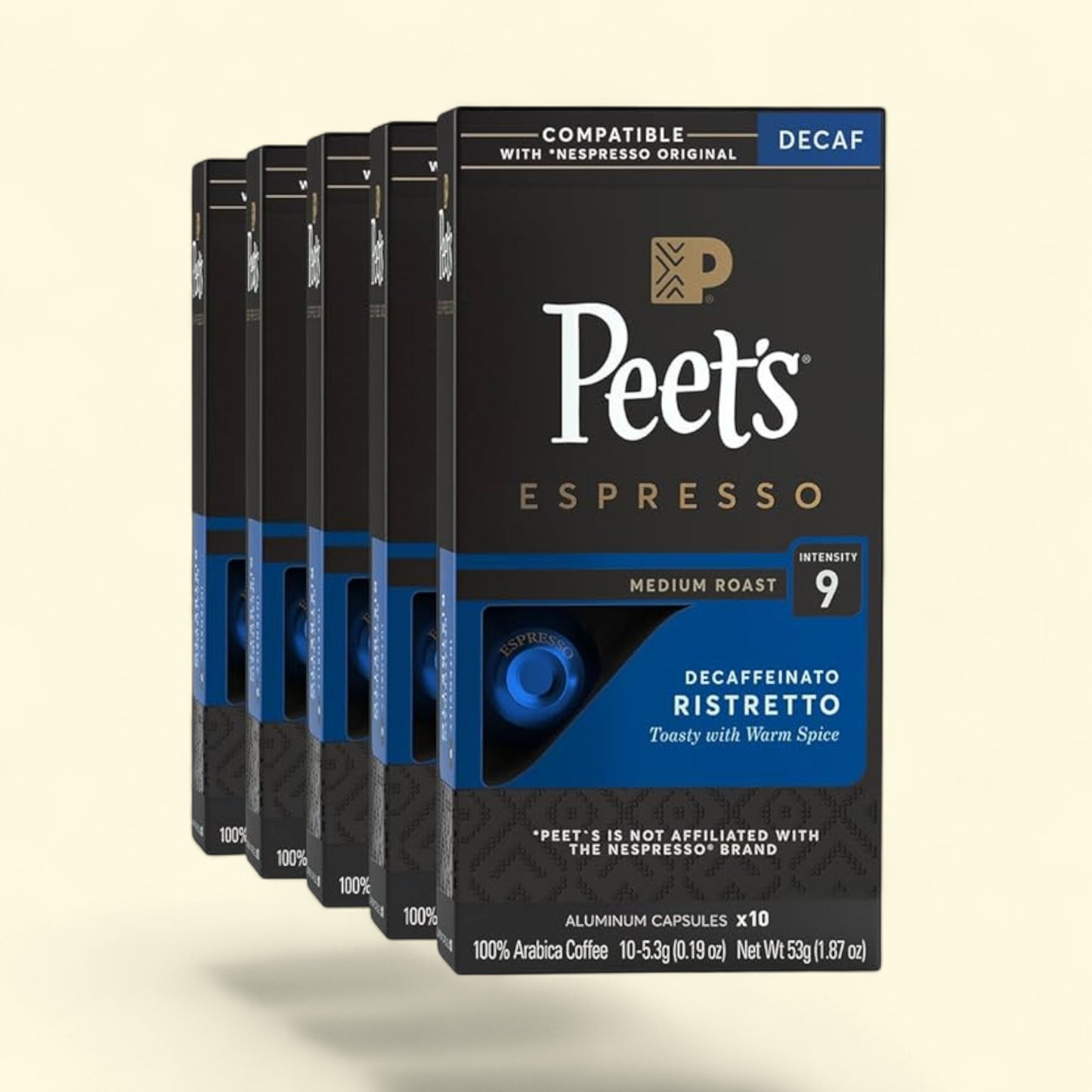 Peet's Espresso Decaf coffee capsule packaging on a beige background