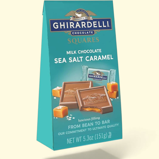 Ghirardelli chocolate squares packaging with sea salt caramel flavor on a light beige background
