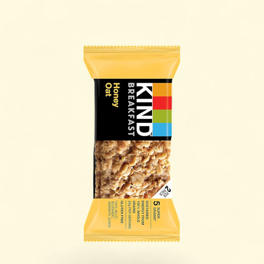 Kind Breakfast Honey Oat bar packaging on a beige background