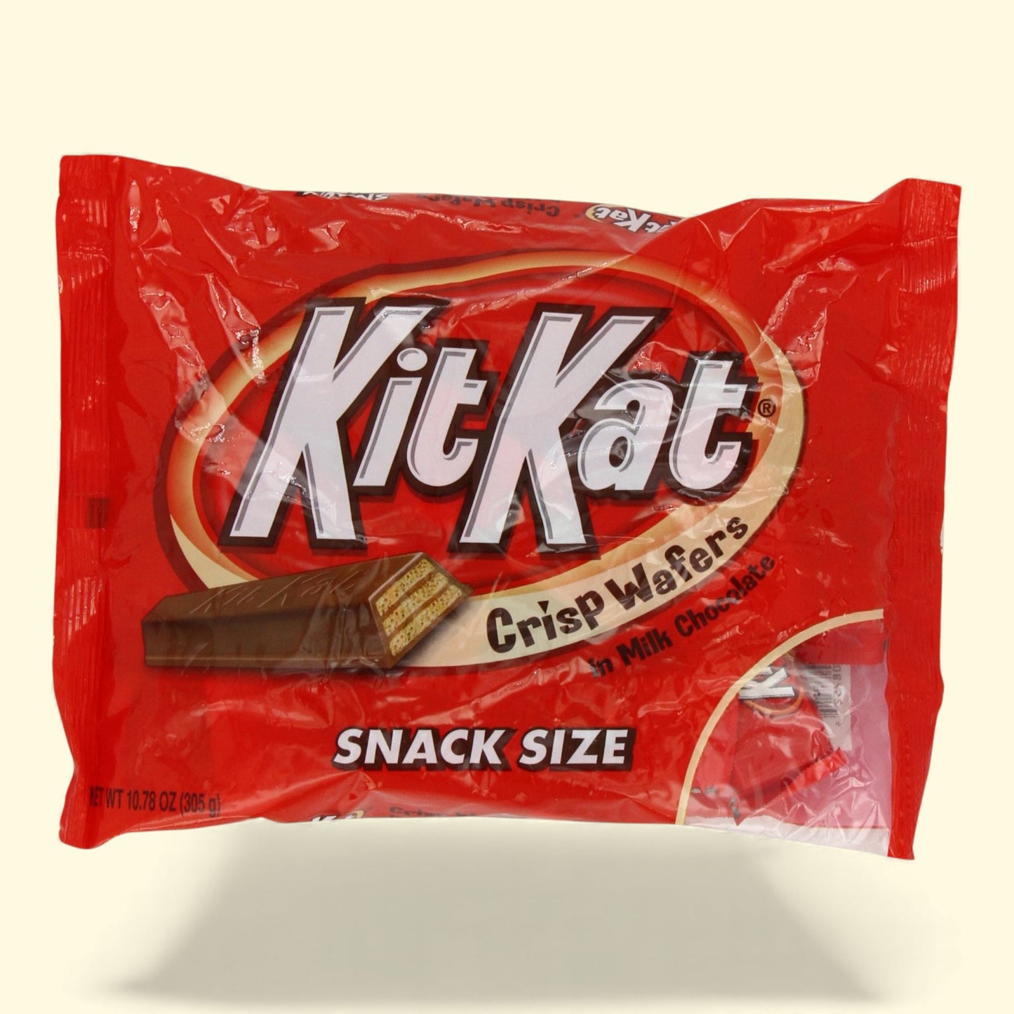 Kit Kat snack size candy bar package on a beige background