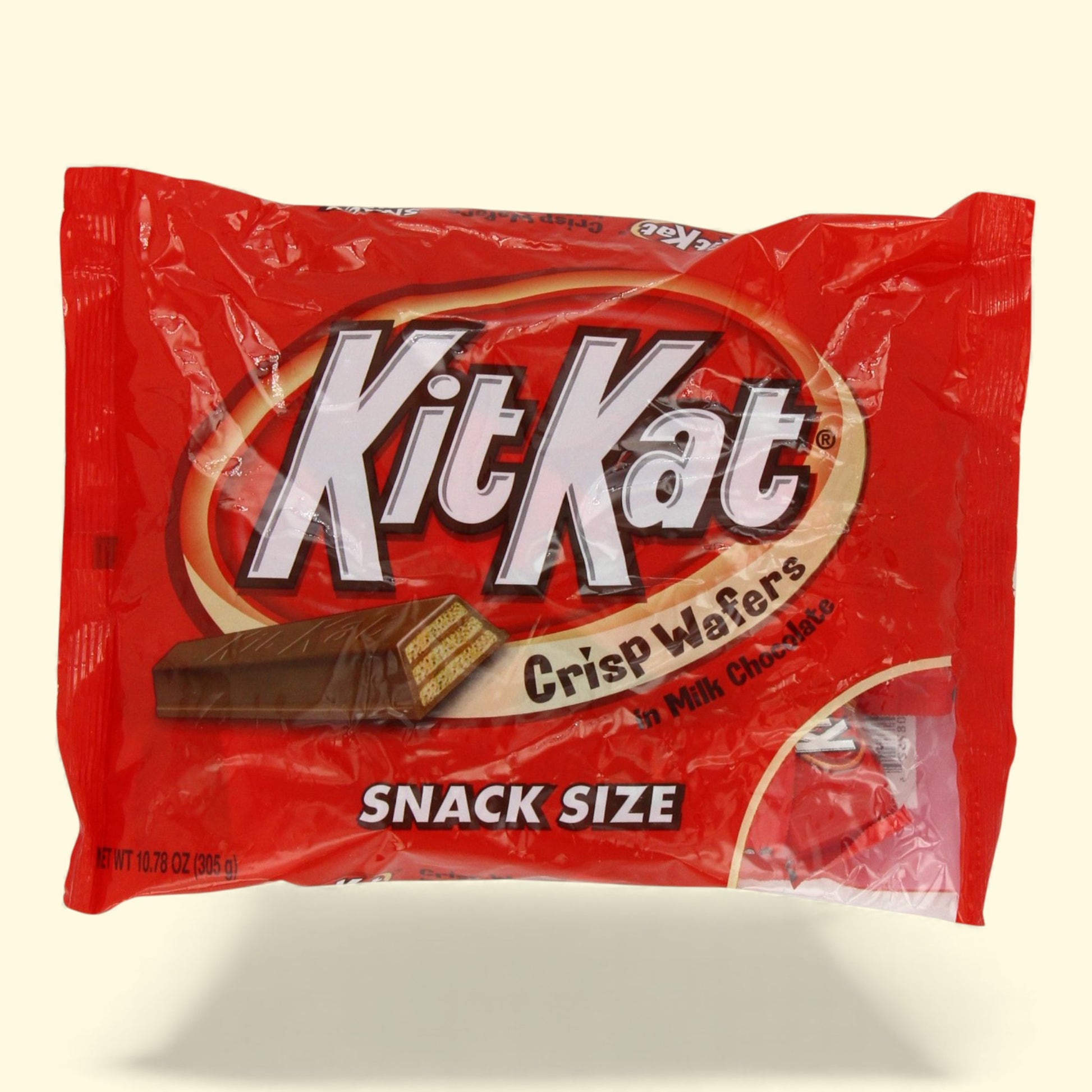 Kit Kat snack size candy bar package on a beige background