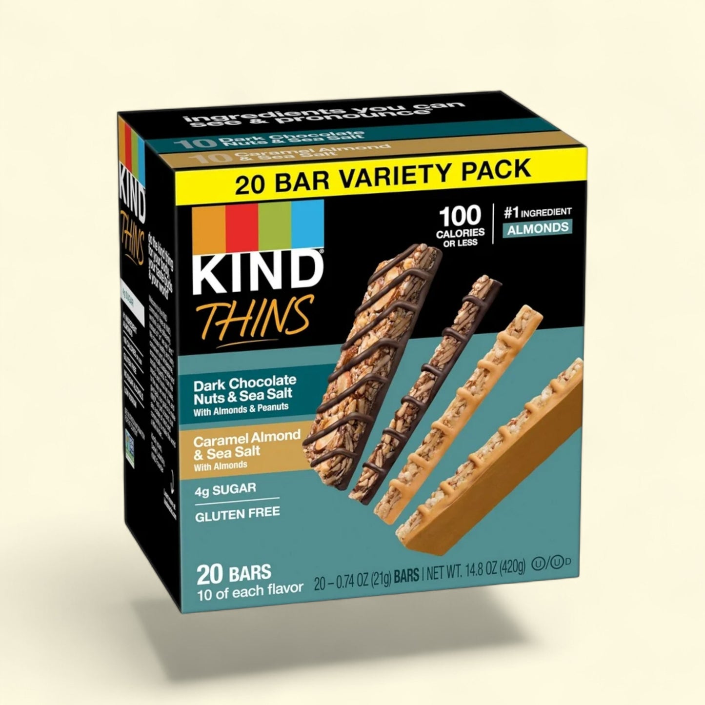 Kind Thins dark chocolate nuts and sea salt bars on a beige background
