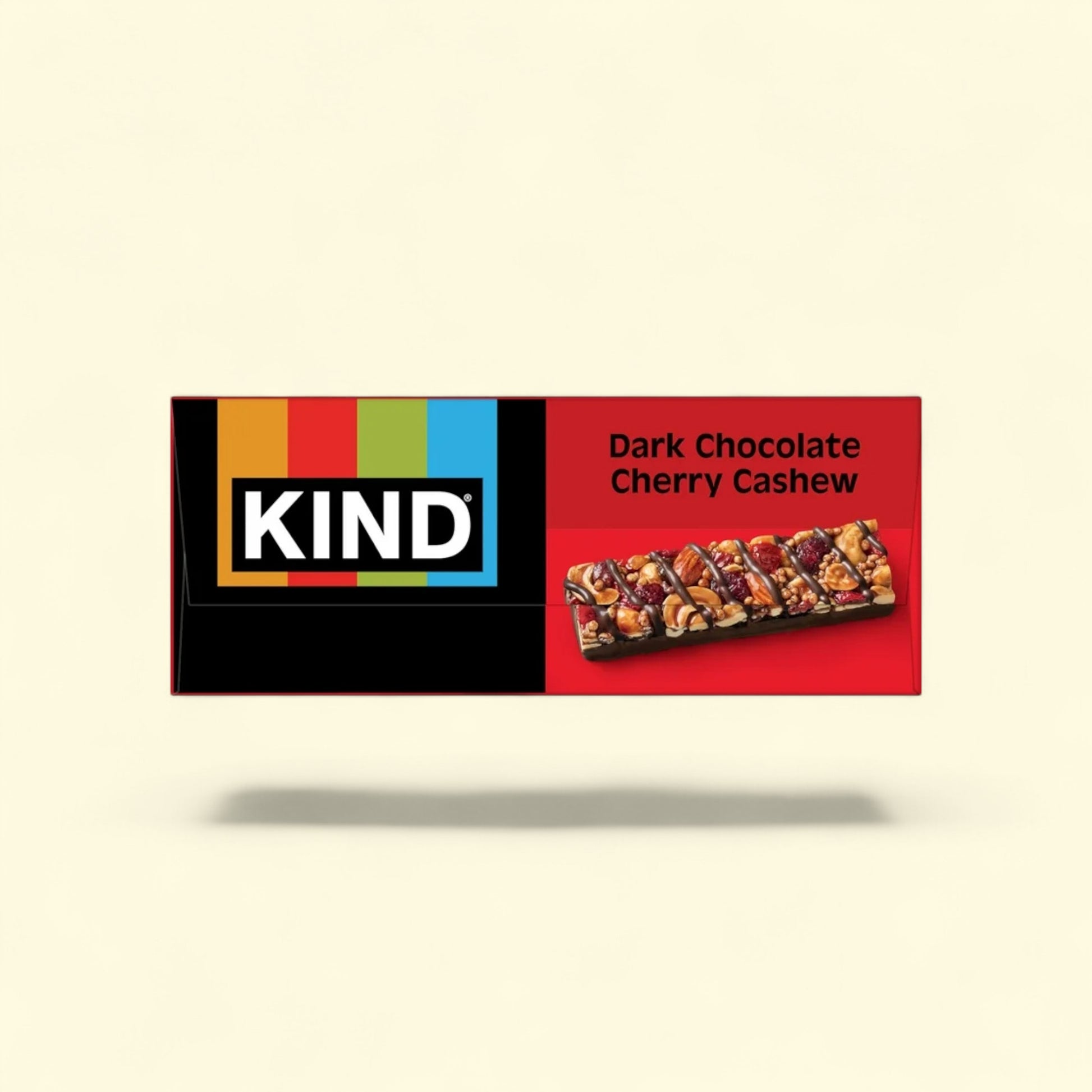 Kind Dark Chocolate Cherry Cashew bar packaging on a beige background