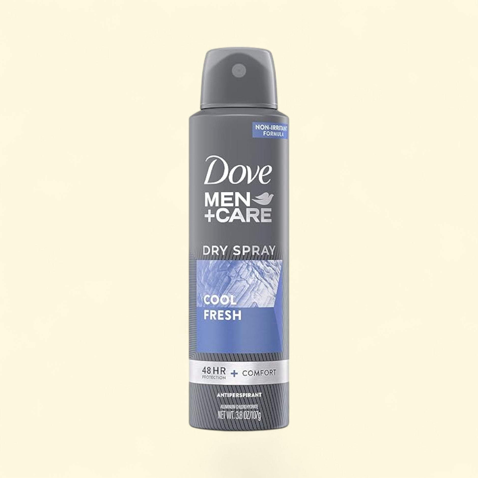 Dove Men+Care dry spray antiperspirant on a beige background