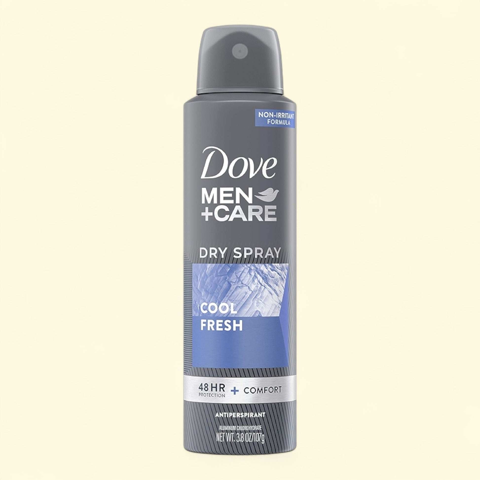 Dove Men+Care dry spray antiperspirant on a beige background