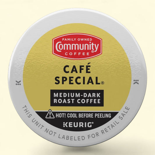 Keurig coffee pod with Community Coffee branding on a beige background
