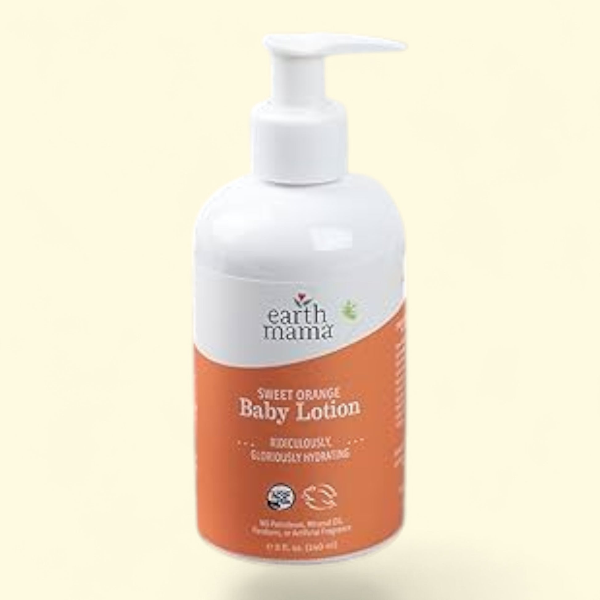 Flacon de lotion pour bébé à l'orange douce Earth Mama sur fond beige