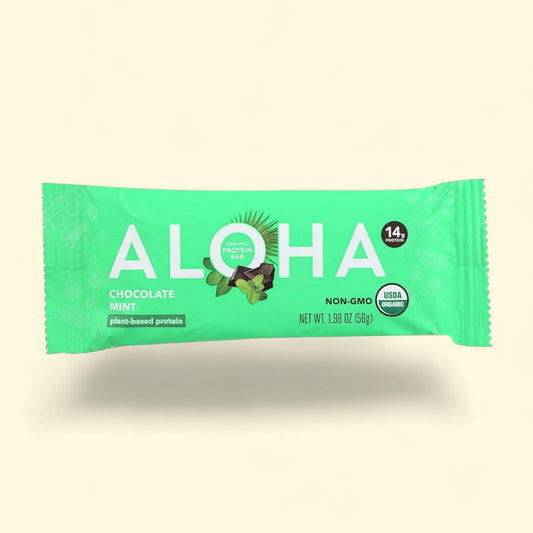 Green protein bar packaging with 'Aloha' branding on a beige background