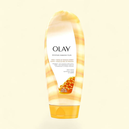 Olay body wash tube with honey design on a beige background