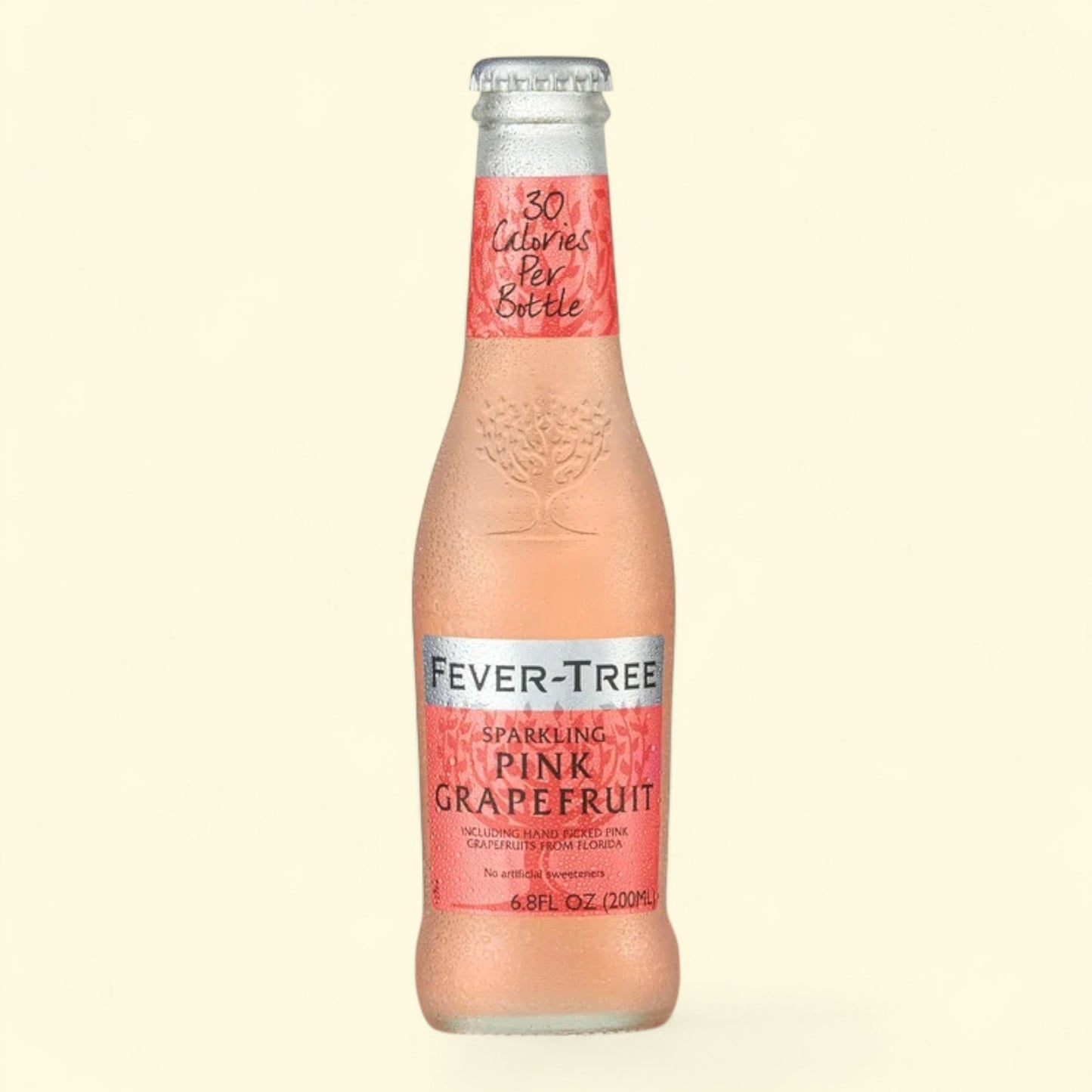 Fever-Tree sparkling pink grapefruit bottle on a beige background