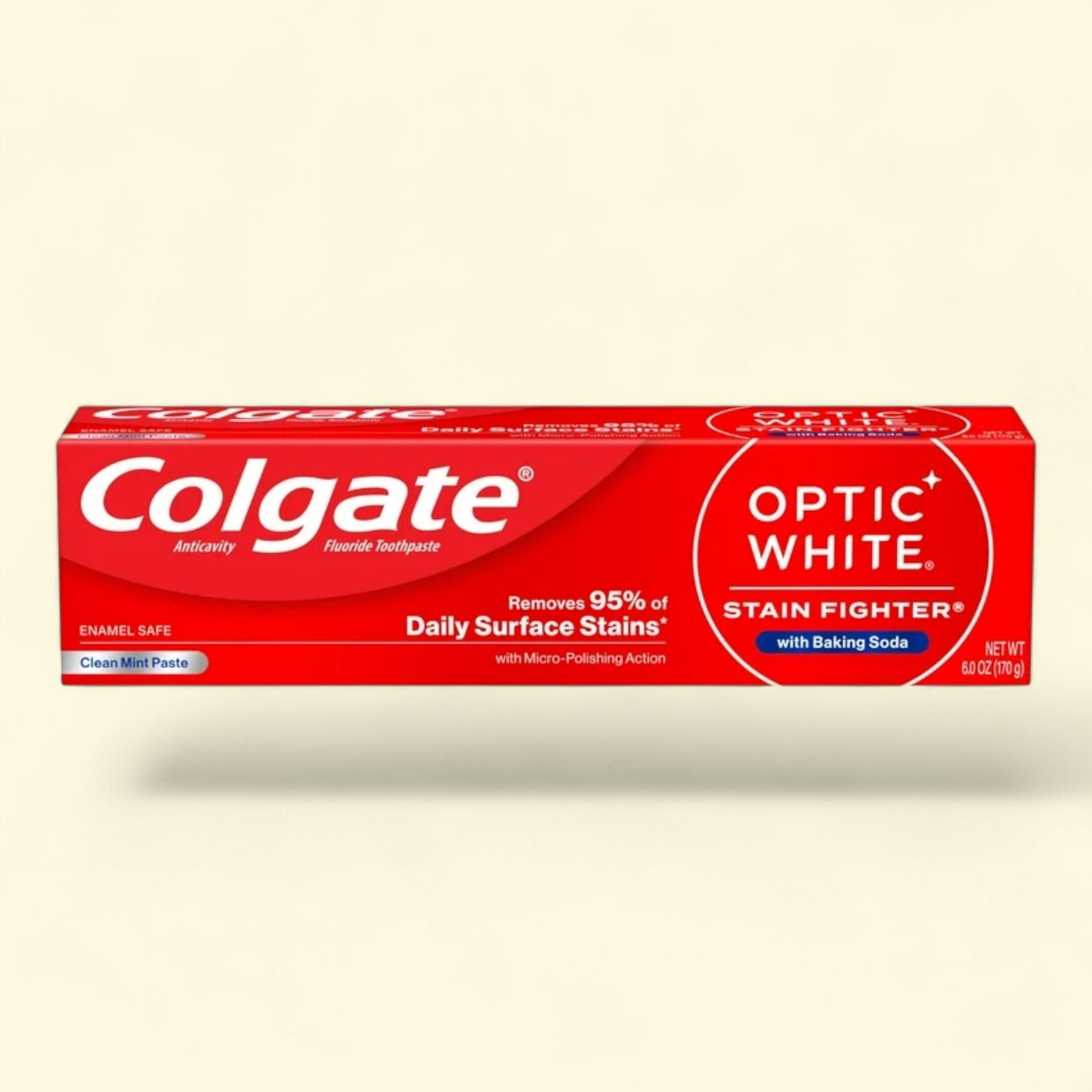 Colgate Optic White toothpaste tube on a beige background