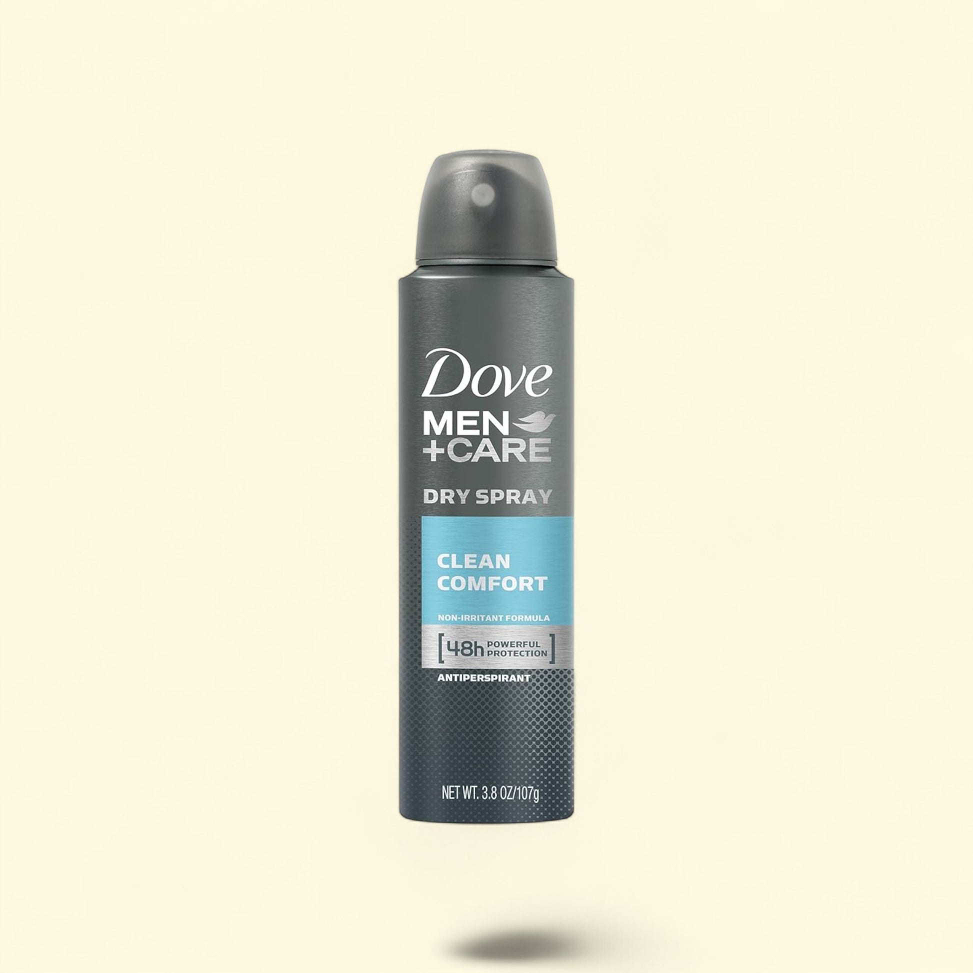 Dove Men+Care dry spray antiperspirant on a beige background
