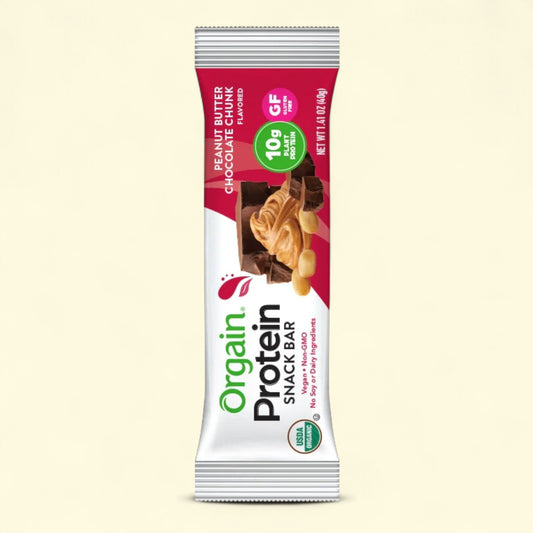 Orgain protein snack bar peanut butter choclate chunk packaging on a beige background