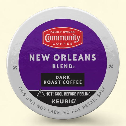 Keurig coffee pod with Community Coffee New Orleans Blend label on a beige background