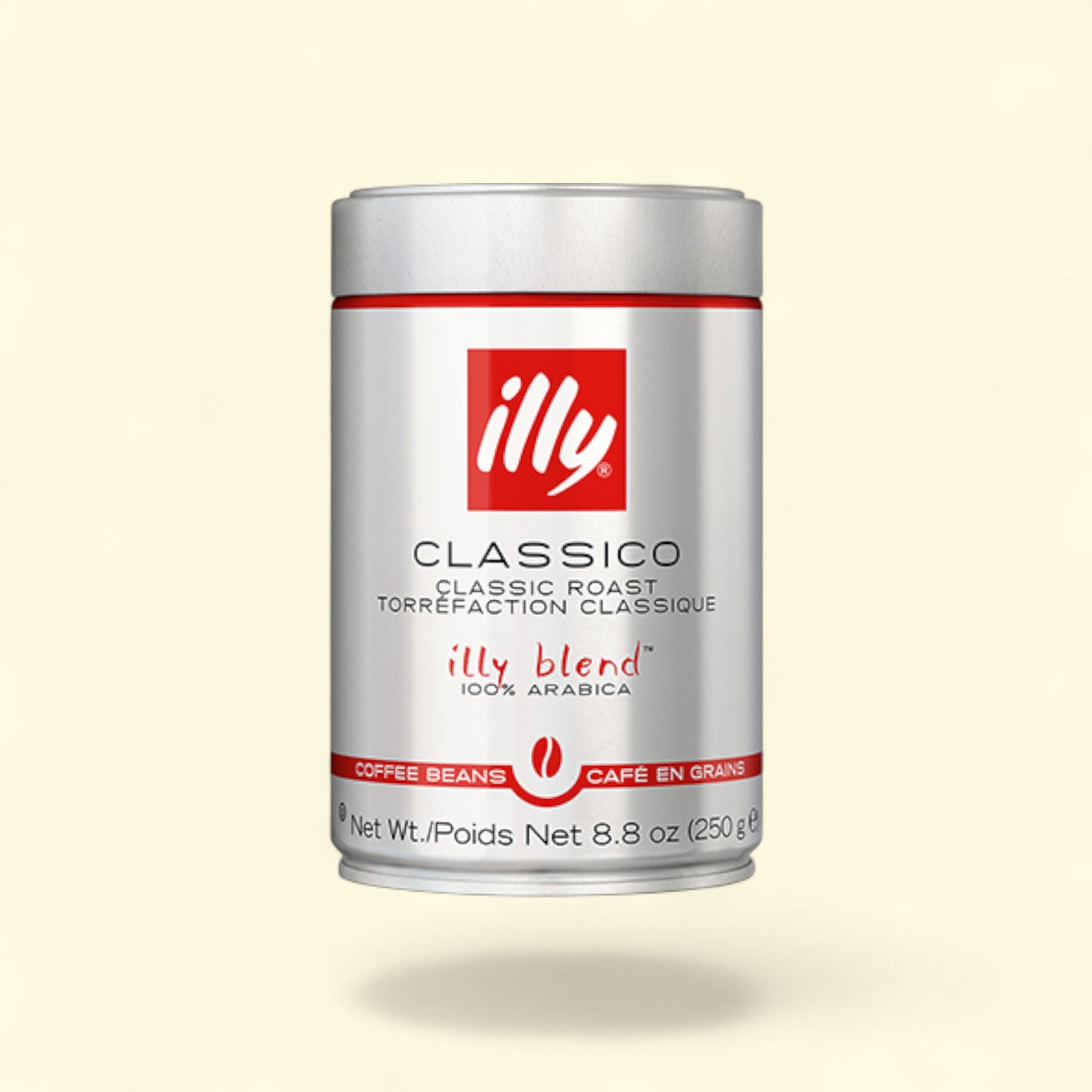 Illy Classico coffee beans canister on a light beige background
