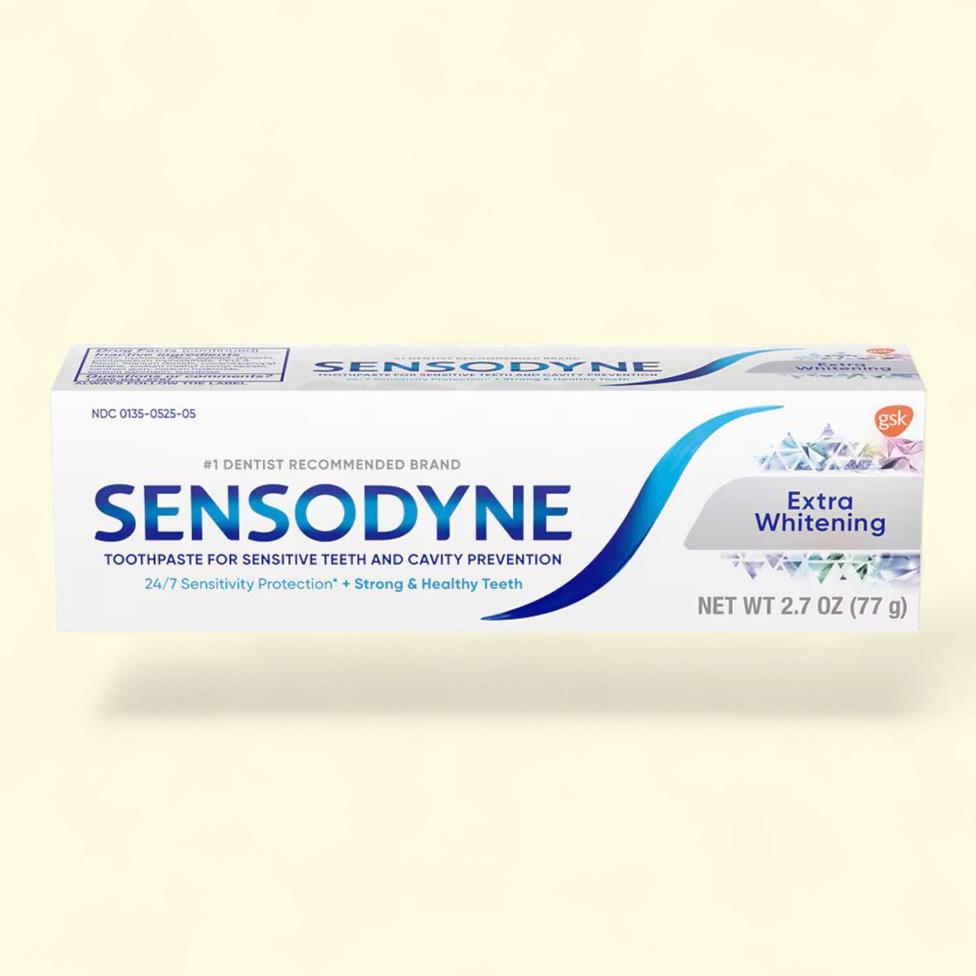 Sensodyne Extra Whitening toothpaste tube on a beige background