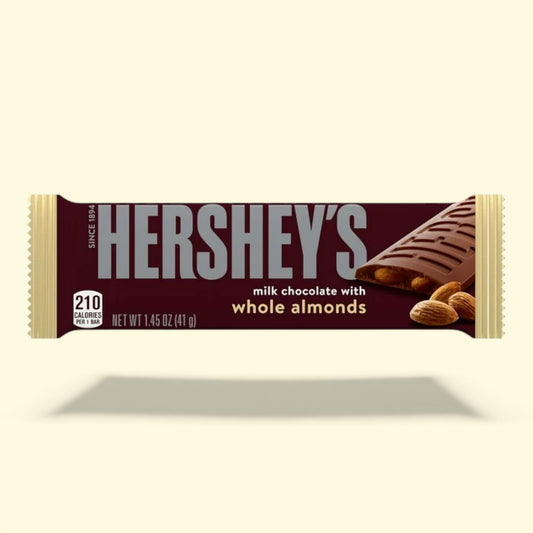 Hershey's milk chocolate bar with whole almonds on a beige background