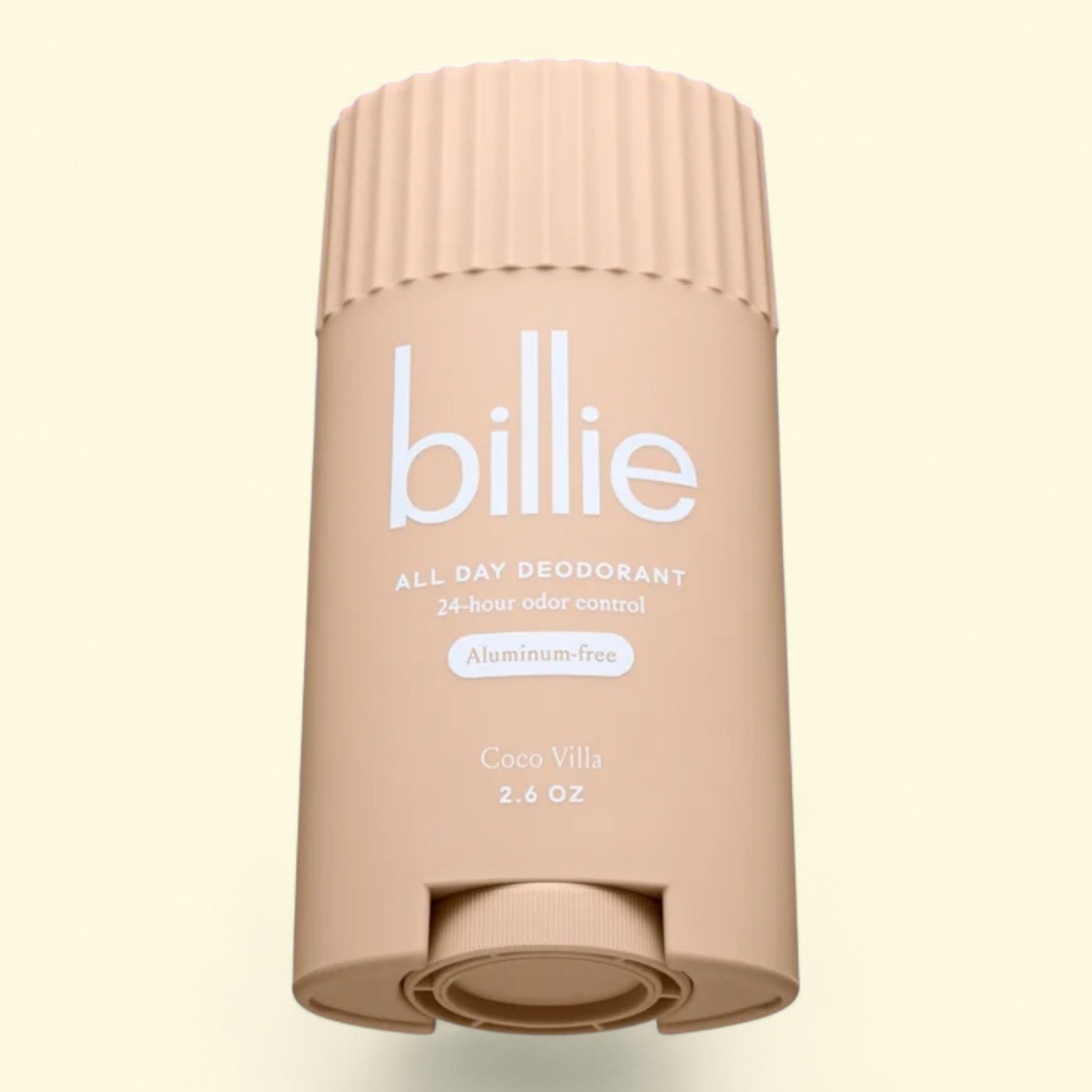 Beige deodorant stick with 'billie' branding on a light beige background