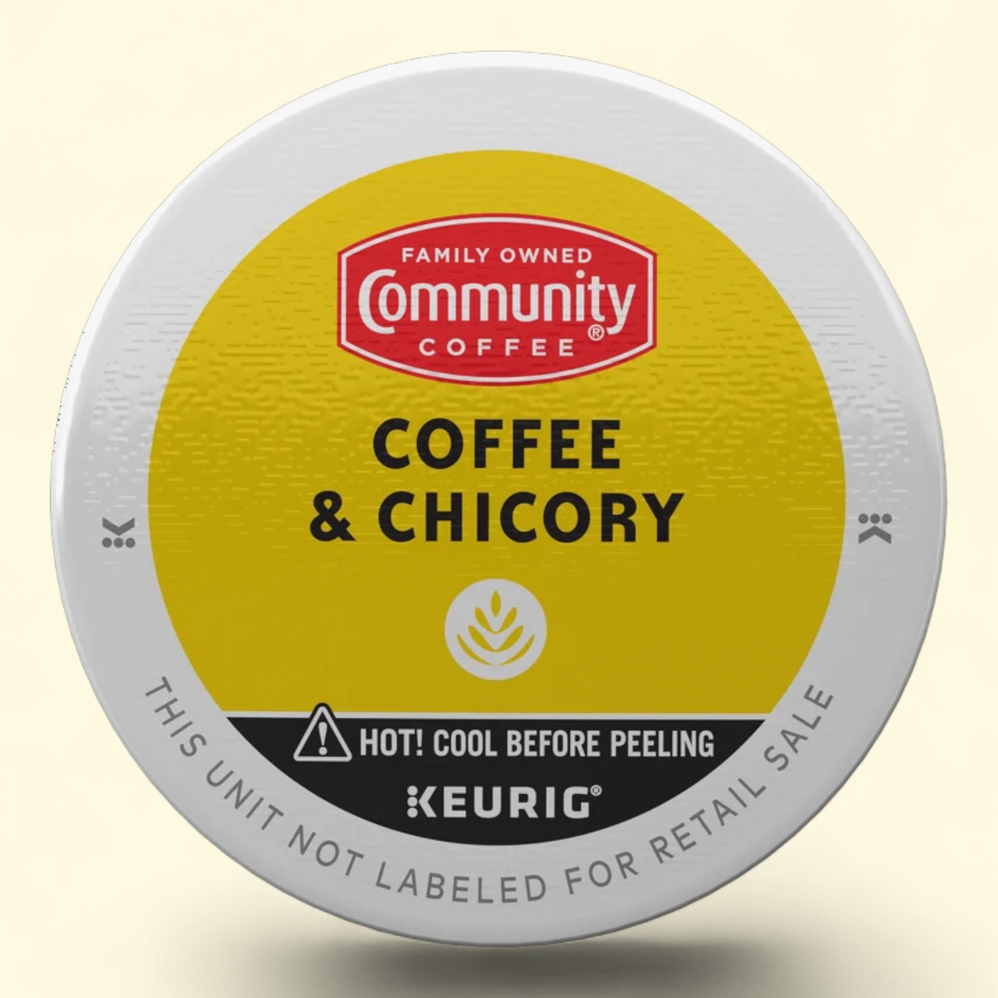 Keurig coffee and chicory with Community Coffee branding on a beige background