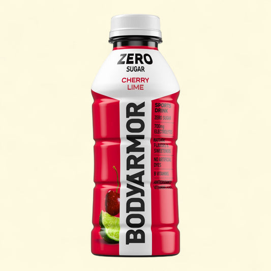 BODYARMOR Cherry Lime sports drink bottle on a beige background