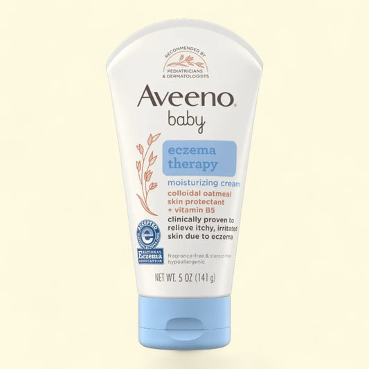 Aveeno baby eczema therapy moisturizing cream on a beige background