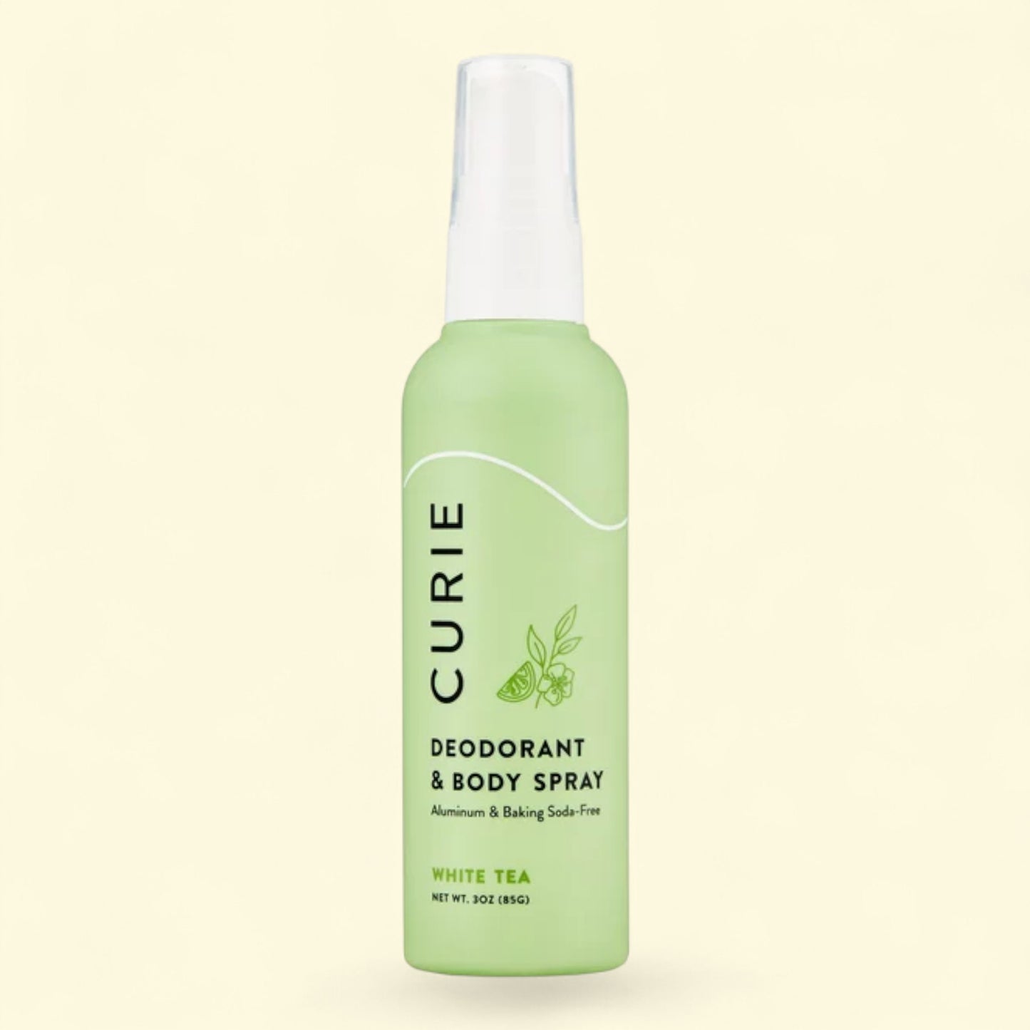 Green Curie deodorant and body spray bottle on a light beige background