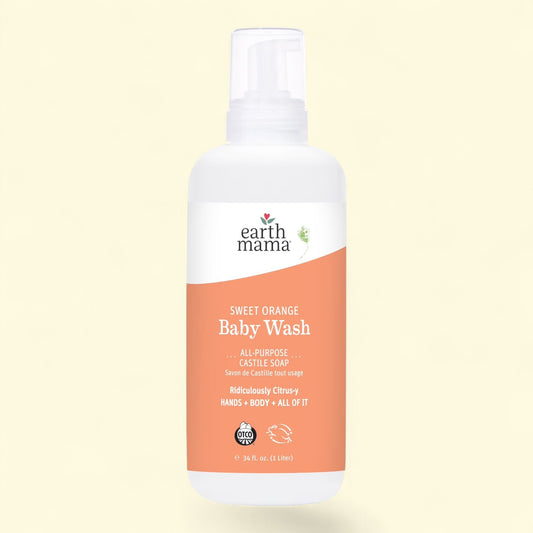 Earth Mama Sweet Orange Baby Wash bottle on a light yellow background