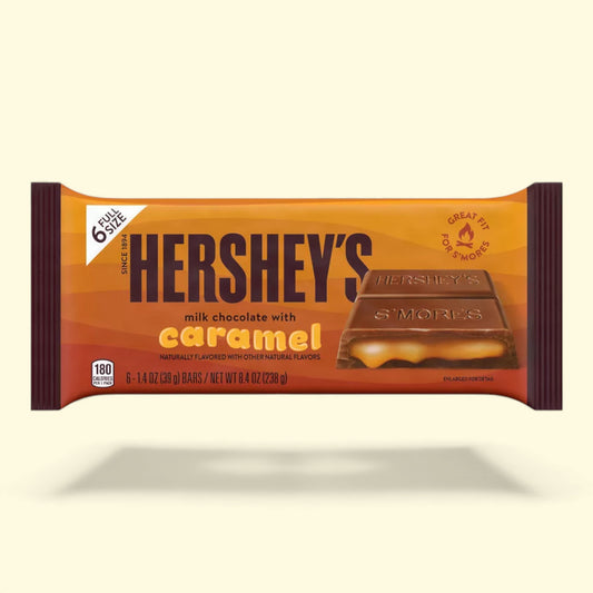 Hershey's milk chocolate with caramel candy bar packaging on a beige background