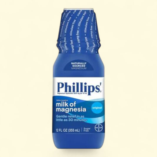 Phillips' Milk of Magnesia bottle on a beige background