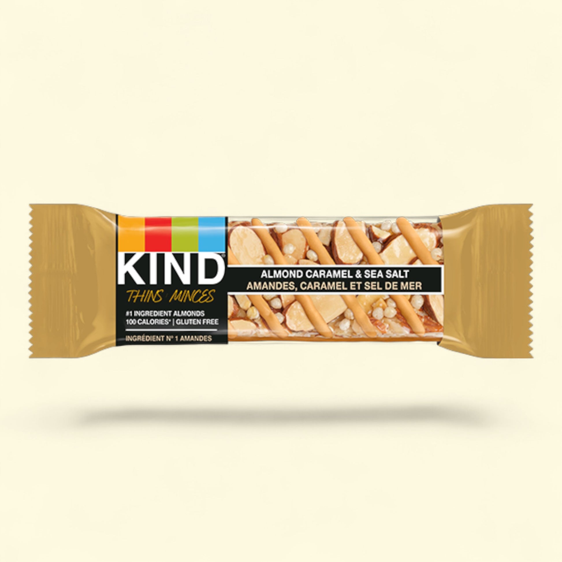 Kind Almond Caramel & Sea Salt bar packaging on a beige background