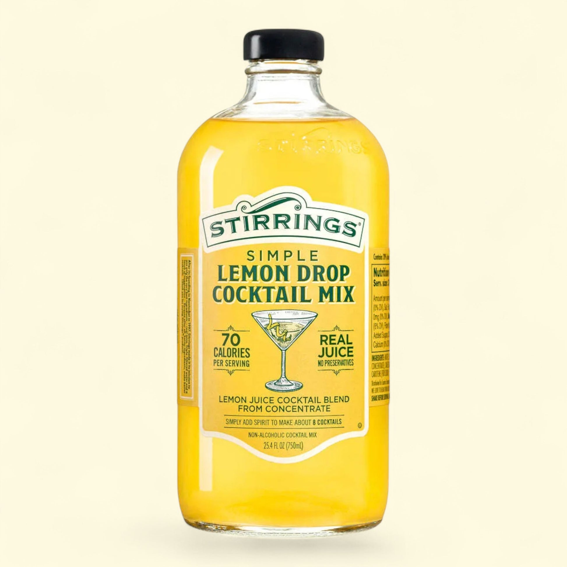 Bottle of Stirrings Lemon Drop Cocktail Mix on a beige background