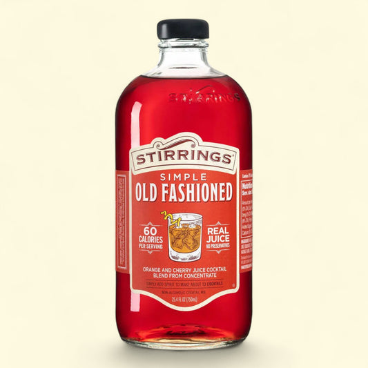 Bottle of Stirrings Simple Old Fashioned on a beige background