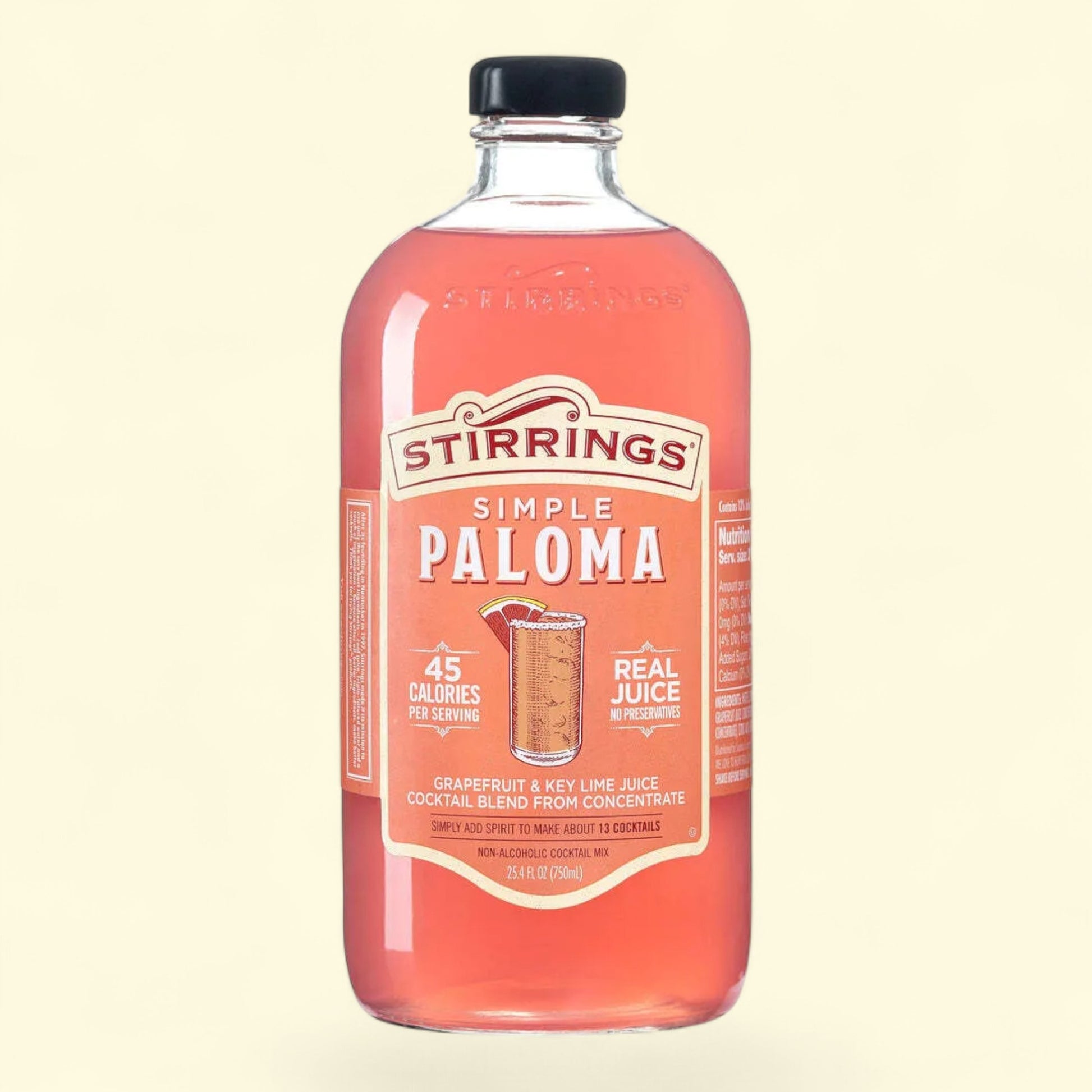 Bottle of Stirrings Simple Paloma on a beige background