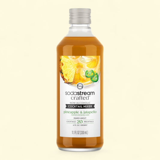 SodaStream cocktail mixer bottle with pineapple and jalapeno flavor on a beige background