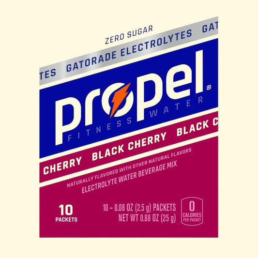 Propel Fitness Water Cherry Black Cherry flavor packaging on a beige background