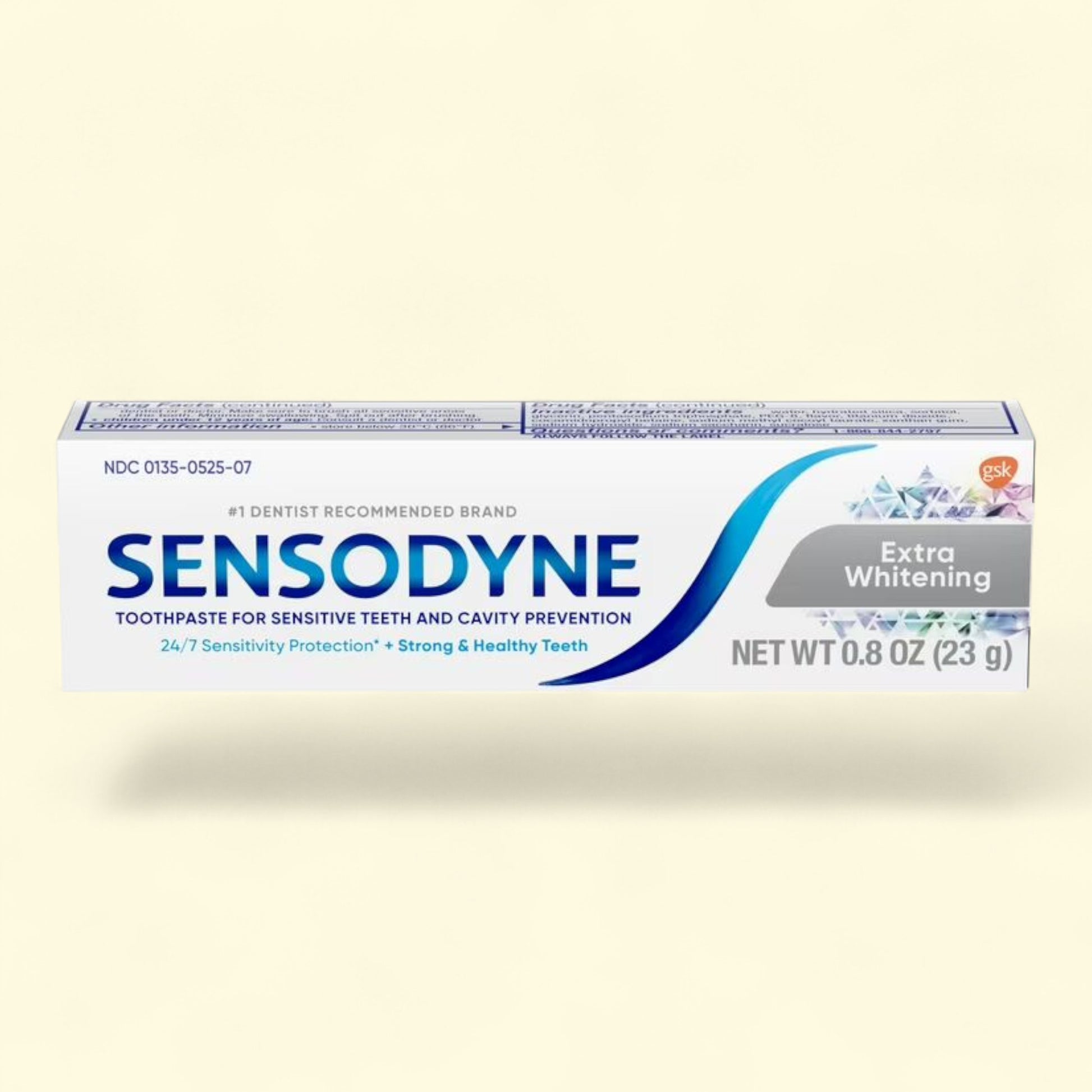 Sensodyne Extra Whitening toothpaste tube on a light beige background