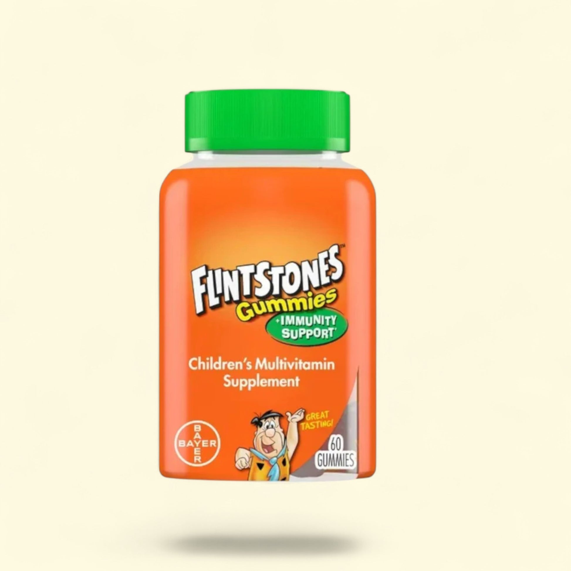 Flintstones Gummies children's multivitamin supplement bottle on a beige background