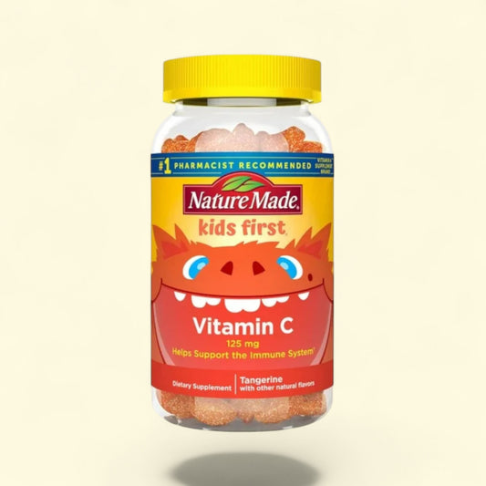 Nature Made Kids First Vitamin C supplement bottle with a yellow lid on a beige background