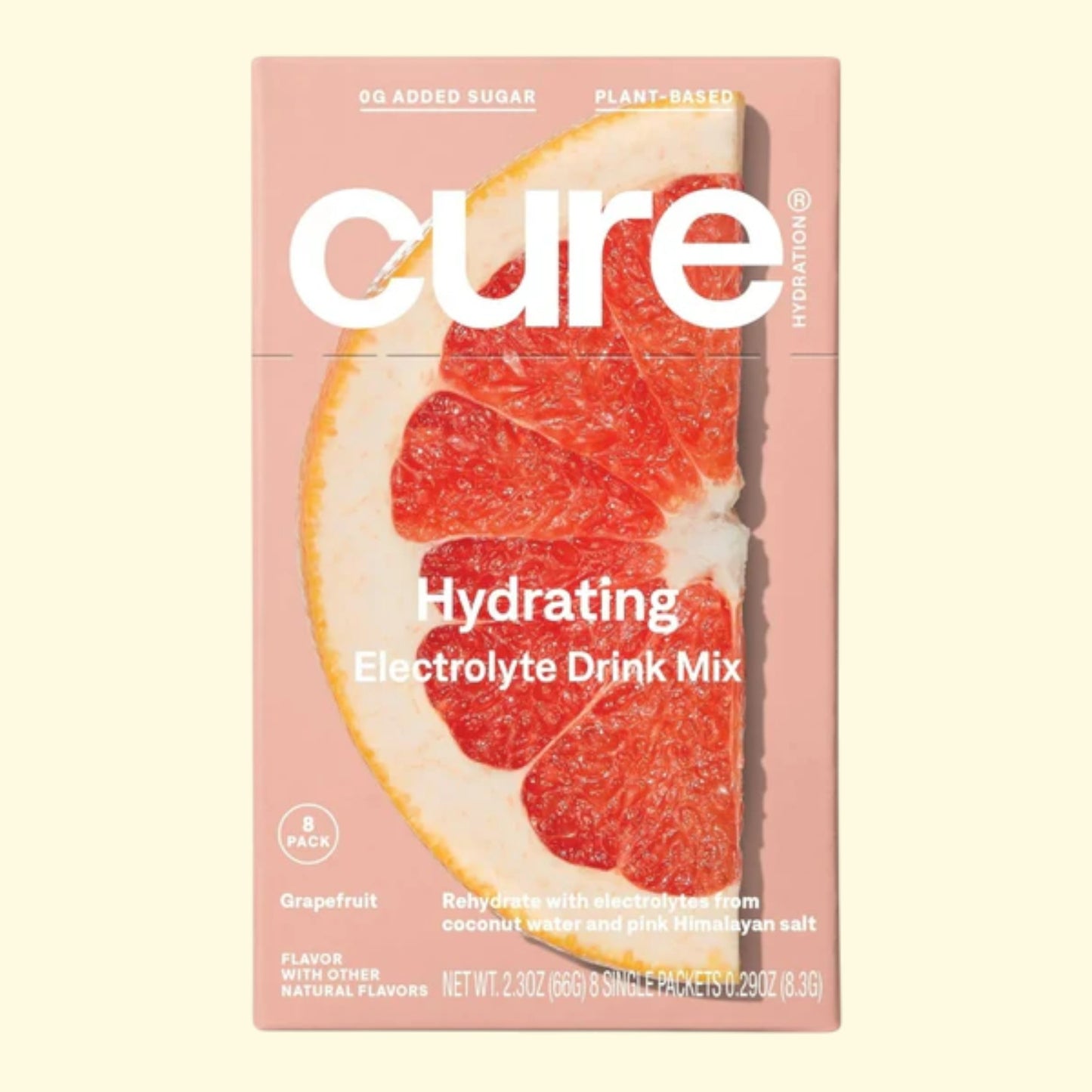 Cure Hydrating Electrolyte Drink Mix packaging with grapefruit slice on a pink background