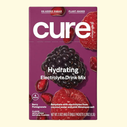 Cure Hydrating Electrolyte Drink Mix packaging with berries on a purple background