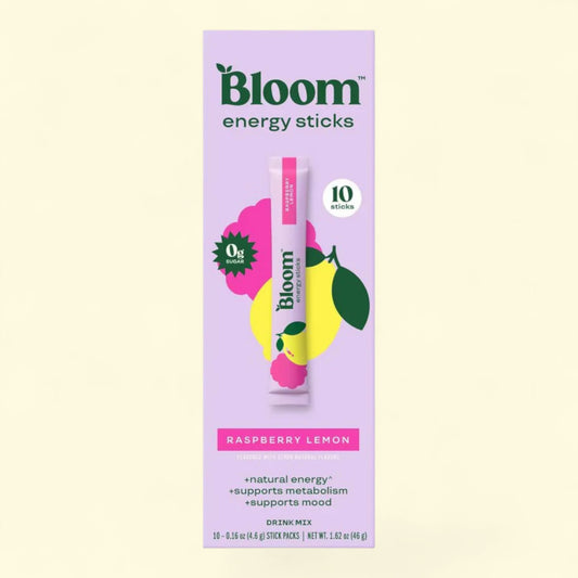 Bloom energy stick packaging with raspberry lemon flavor on a light yellow background