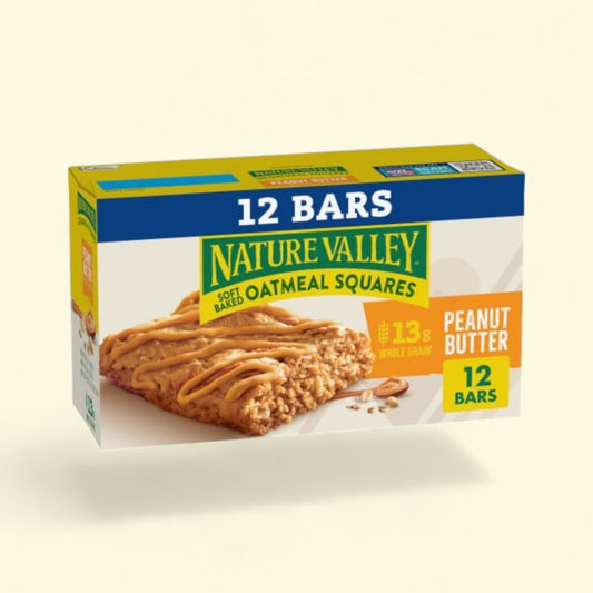 Box of Nature Valley Oatmeal Squares Peanut Butter bars on a beige background