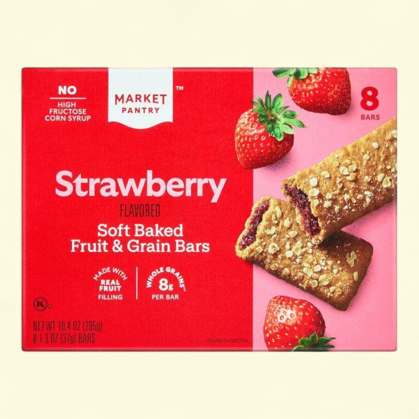 Box of strawberry flavored soft baked fruit and grain bars with strawberries on a red background
