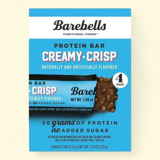 Barebells Creamy Crisp protein bar packaging on a beige background