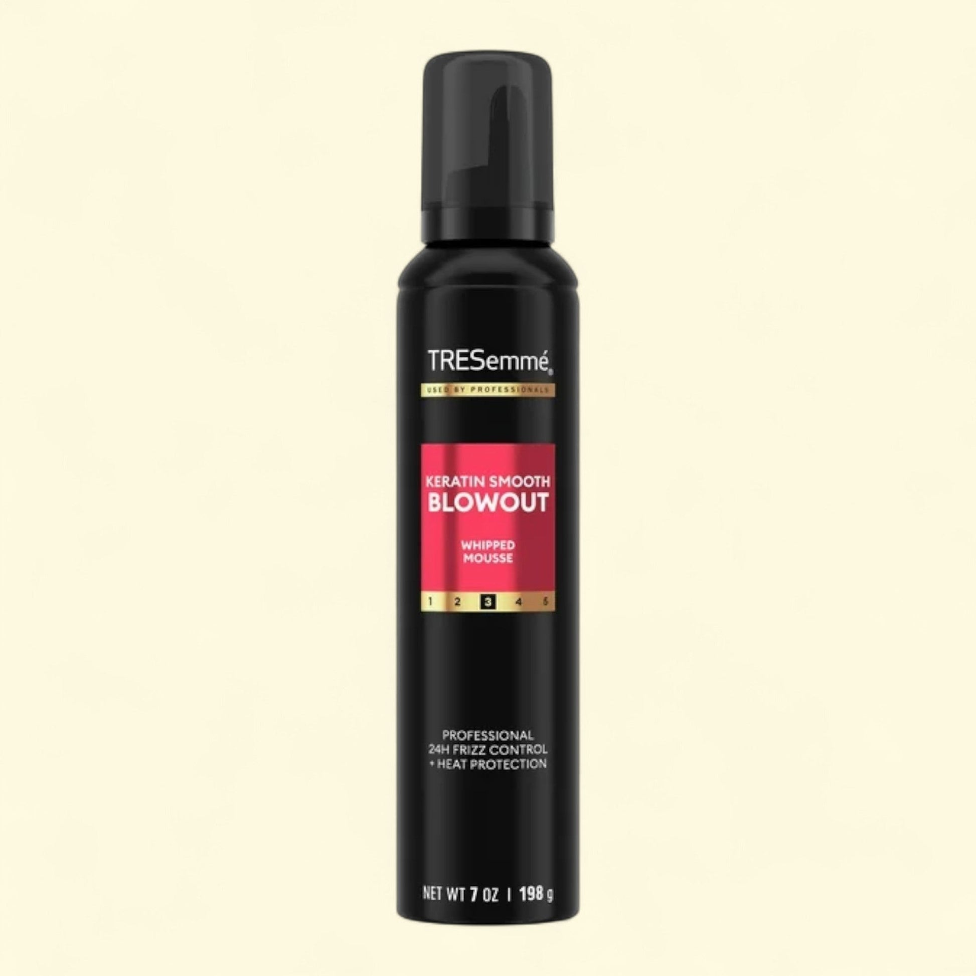 TRESemme Keratin Smooth Blowout whipped mousse bottle on a black background