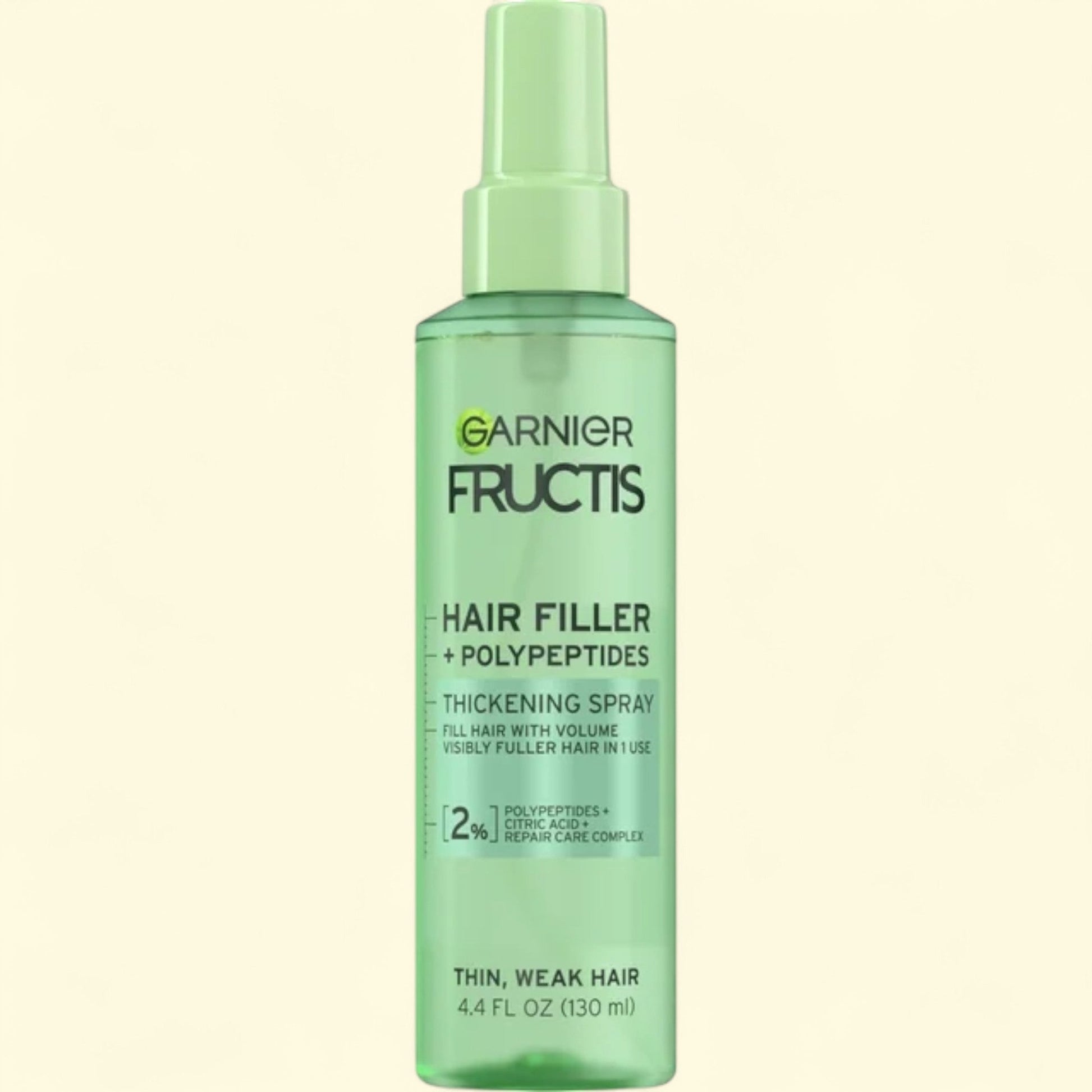 Garnier Fructis Hair Filler + Polypeptides spray bottle on a white background